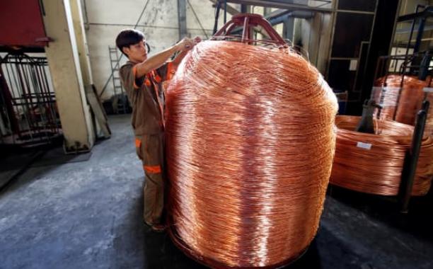 A worker labels copper products at Truong Phu cable factory in northern Hai Duong province, outside Hanoi, Vietnam August 11, 2017. Kham | Reuters