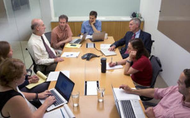 Two architects of the Natural Resources Defense Council’s carbon-emissions proposal, David Doniger, third from left, and Daniel Lashof, facing him, participate in a meeting at the group’s office in Washington. 