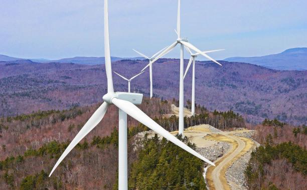 Wind-energy projects like the Groton Wind Farm in New Hampshire require huge amounts of land -- and rural communities are not all happy about it.  Credit: AerialPhotoNH