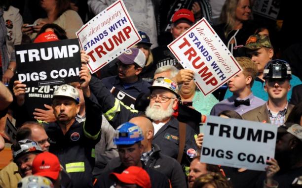 FILE PHOTO: People show their support as Donald Trump speaks in Charleston, West Virginia, U.S., May 5, 2016. REUTERS/Chris Tilley/File Photo