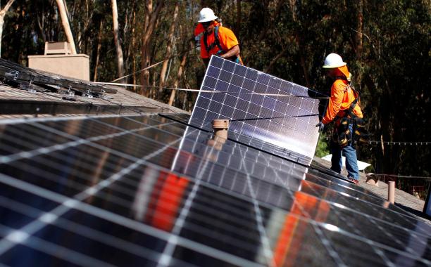 Installing solar panels on a home in Scripps Ranch, Calif. (Reuters photo: Mike Blake)